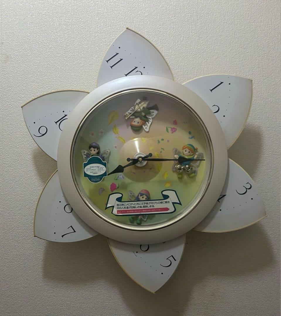 Small World 花の形状 掛時計 動く人形付き 毎正時に花が咲く からくり時計 スモールワールドエクロール - YouTube