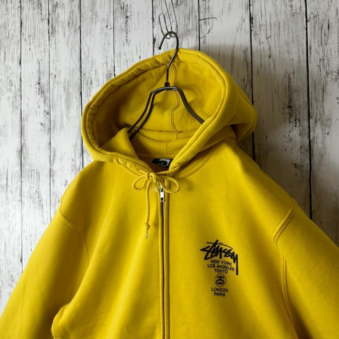 新品】ステューシー ワールドツアー ジップアップ パーカー S イエロー