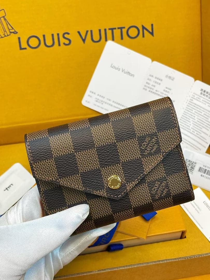 LOUIS VUITTON ダミエ・エベヌ 二つ折り財布 - メルカリ