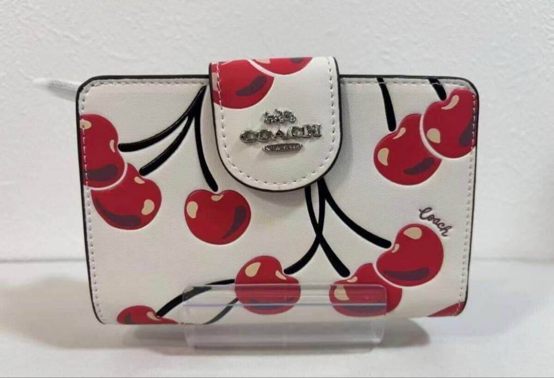 COACH チェリー柄 二つ折り財布 - メルカリ